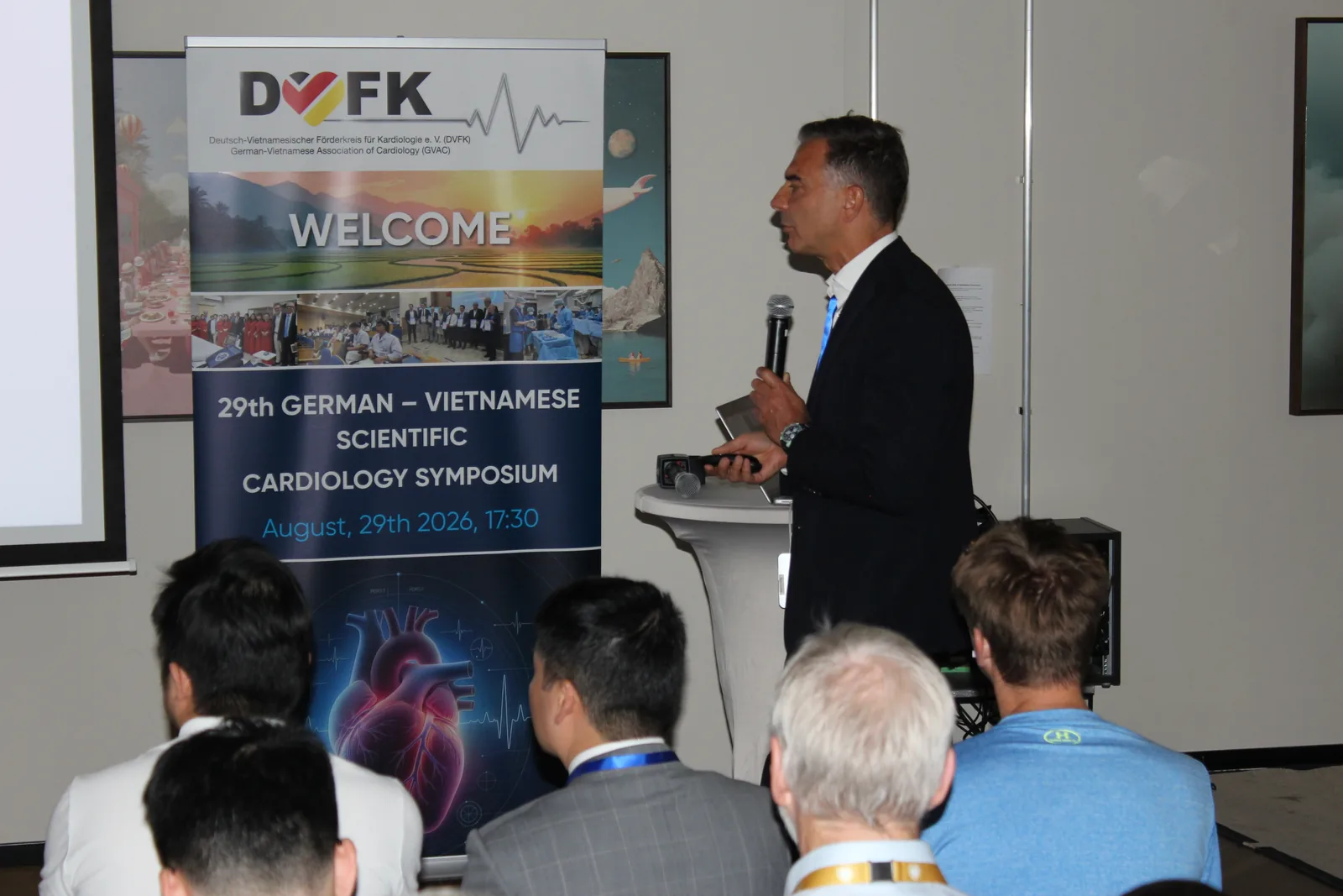 Opening of the symposium in front of the DVFK welcome banner